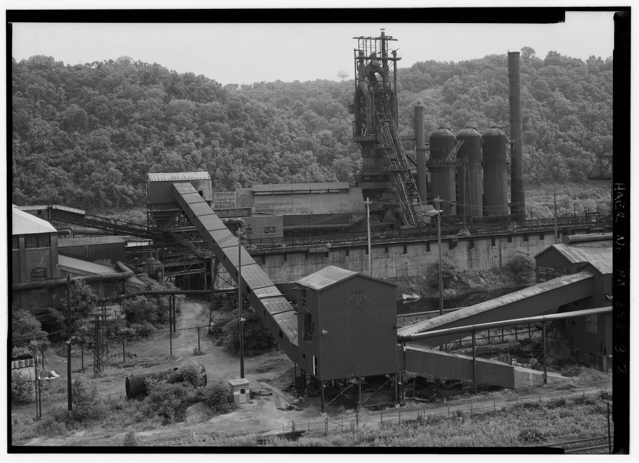 MIM sintering furnace where densification drives the linear shrinkage that mold scaling must compensate